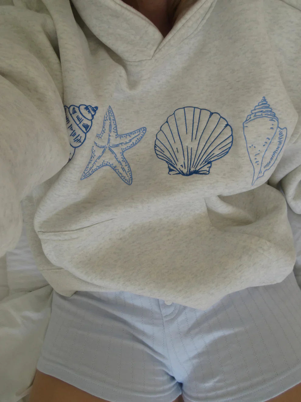 Sweat à capuche coquillage